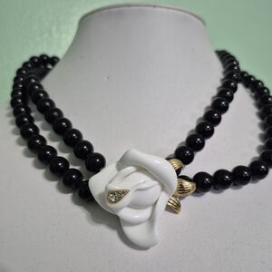 Avon Black Bead Necklace with White Flower and Gold Accents